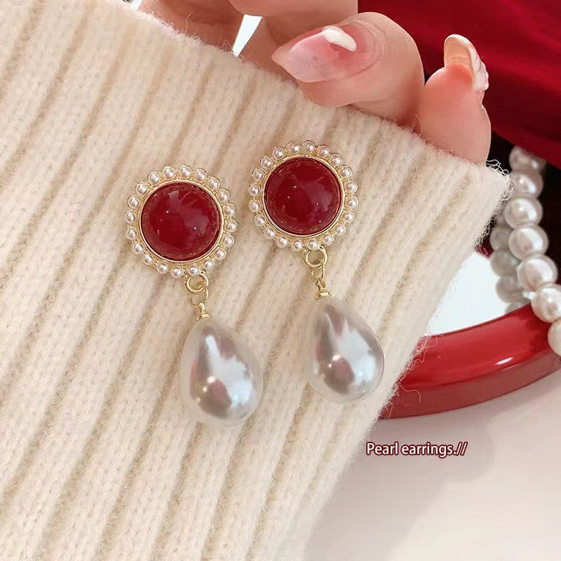 Red oval pearl earrings