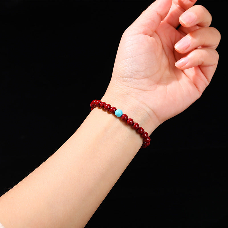 Cinnabar bead bracelet.