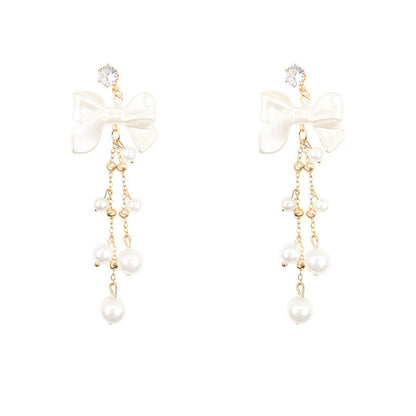 Long bow pearl fringed earrings