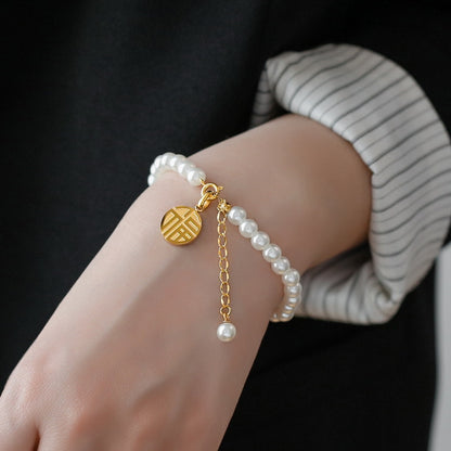 Pearl fringed Fu brand bracelet