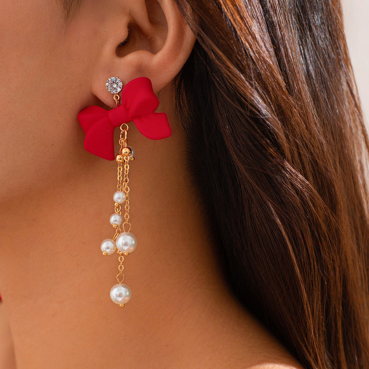 Red bow stud earrings