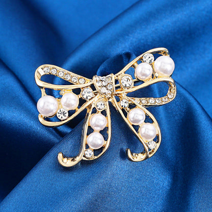 Bow pearl brooch