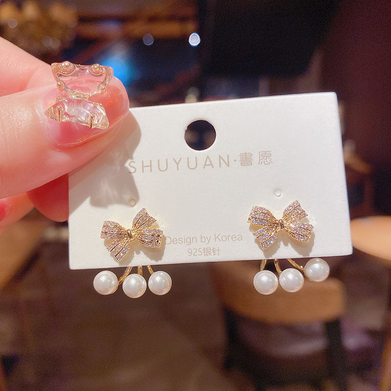 Niche bow pearl earrings