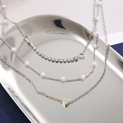 Heart-shaped diamond and pearl three-layer necklace