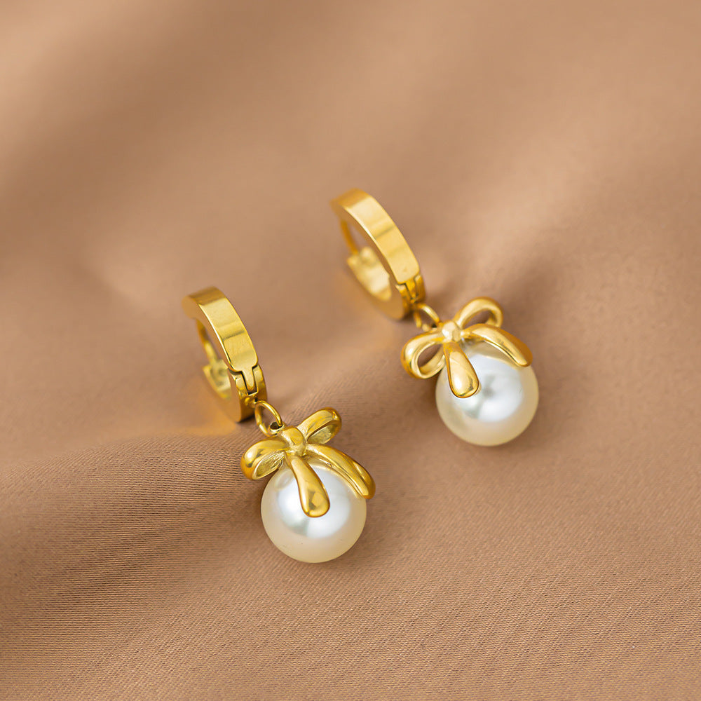 French bow pearl earrings