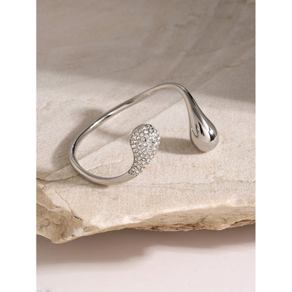 Asymmetric teardrop rhinestone cuff bracelet