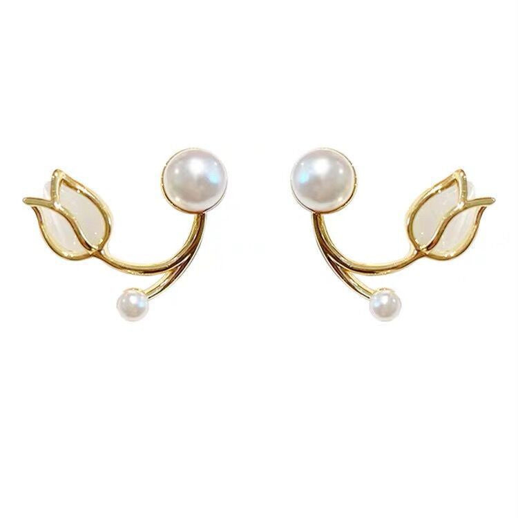 A pair of tulip flower pearl stud earrings.