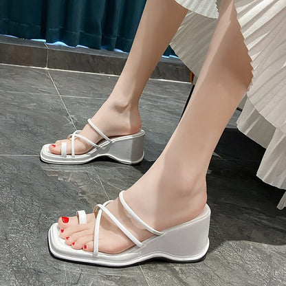 Women wearing wedge heels slippers