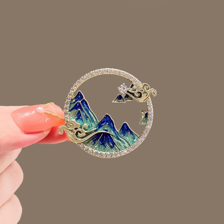 Thousand miles of rivers and mountains brooch