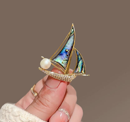 Small sail brooch