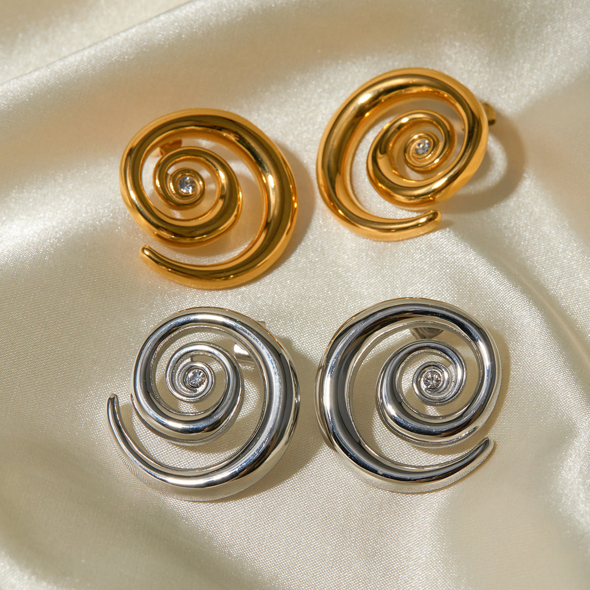 Swirl design diamond earrings