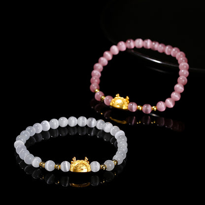 Pink and white cat's eye stone dragon steamed dumpling bracelet.