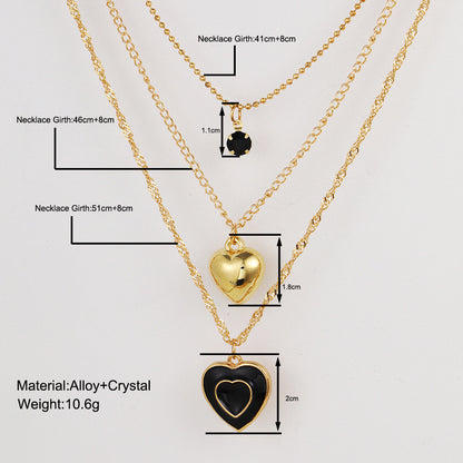 Multi-layered black oil-dripping peach heart necklace