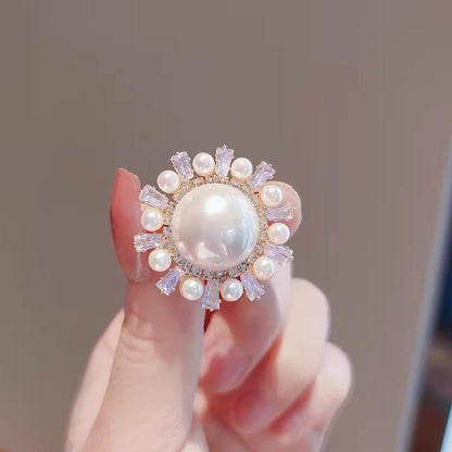 Round anti-pearl brooch