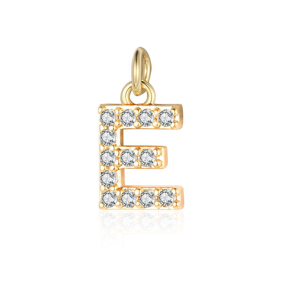 Copper zircon yellow gold letter pendant.