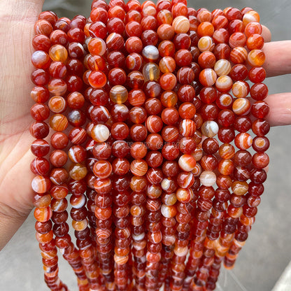 Perlas sueltas redondas de ágata rayada roja