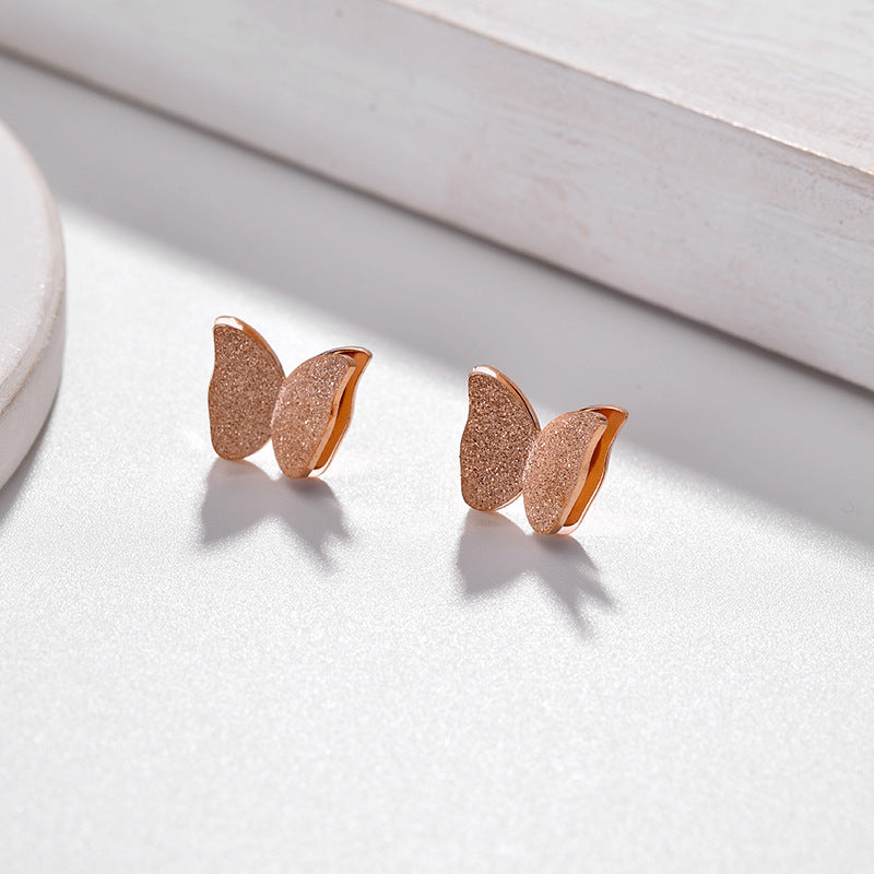 Frosted butterfly stud earrings