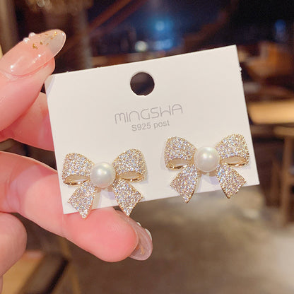 Bow stud earrings woman