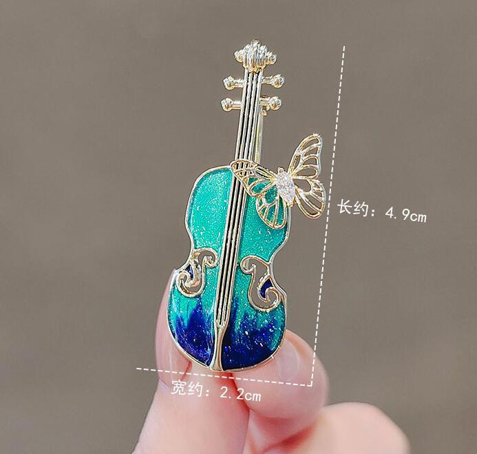 Blue violin brooch