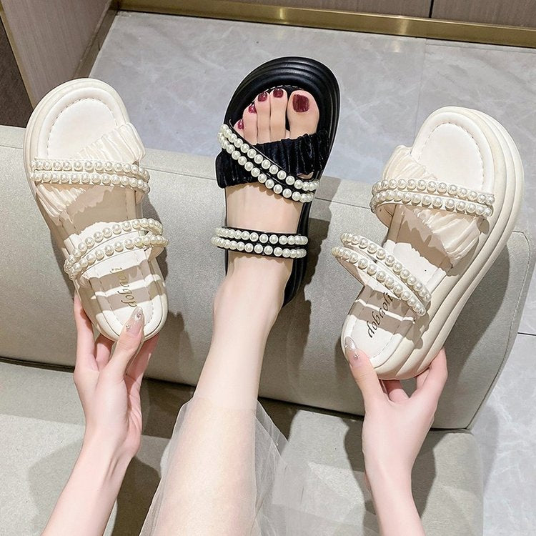 Two pairs of slippers and sandals.