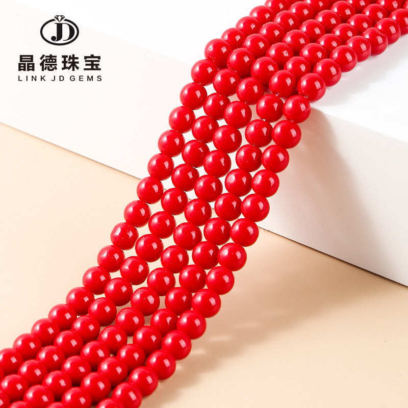 Red lacquered synthetic beads