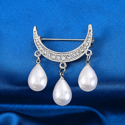 Bow pearl brooch