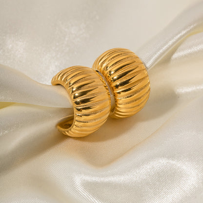 Wide breaded C-shaped earrings