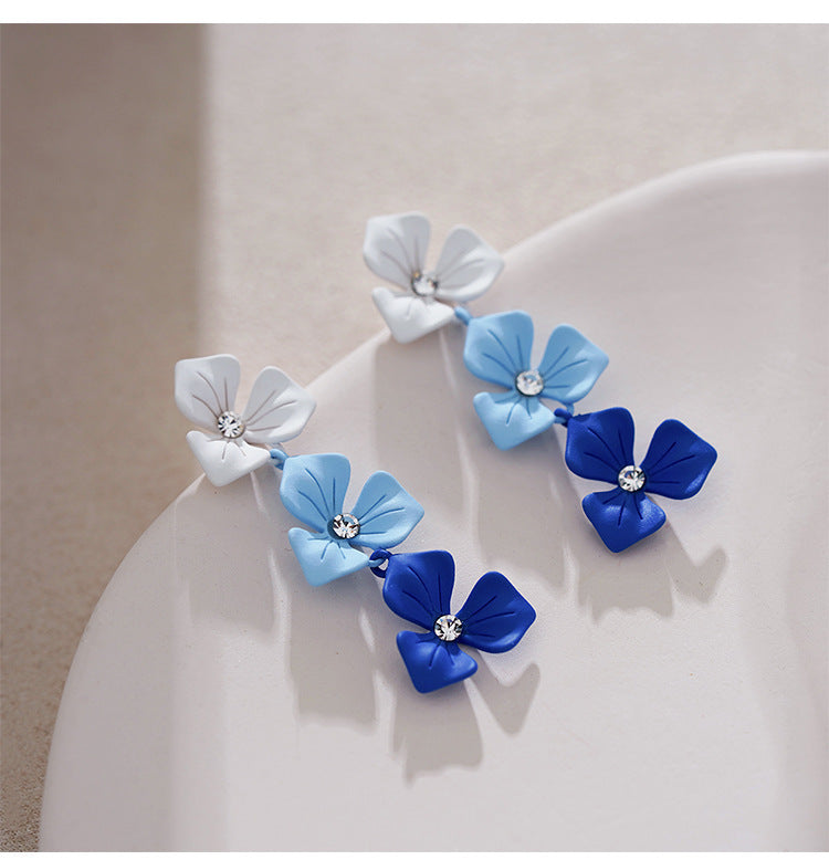 Klein blue stud earrings gradually change flowers