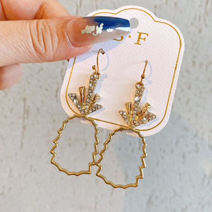 Gold hollow pineapple earrings