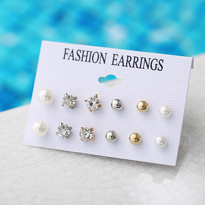 Set of 9 pairs of four-claw zircon earrings