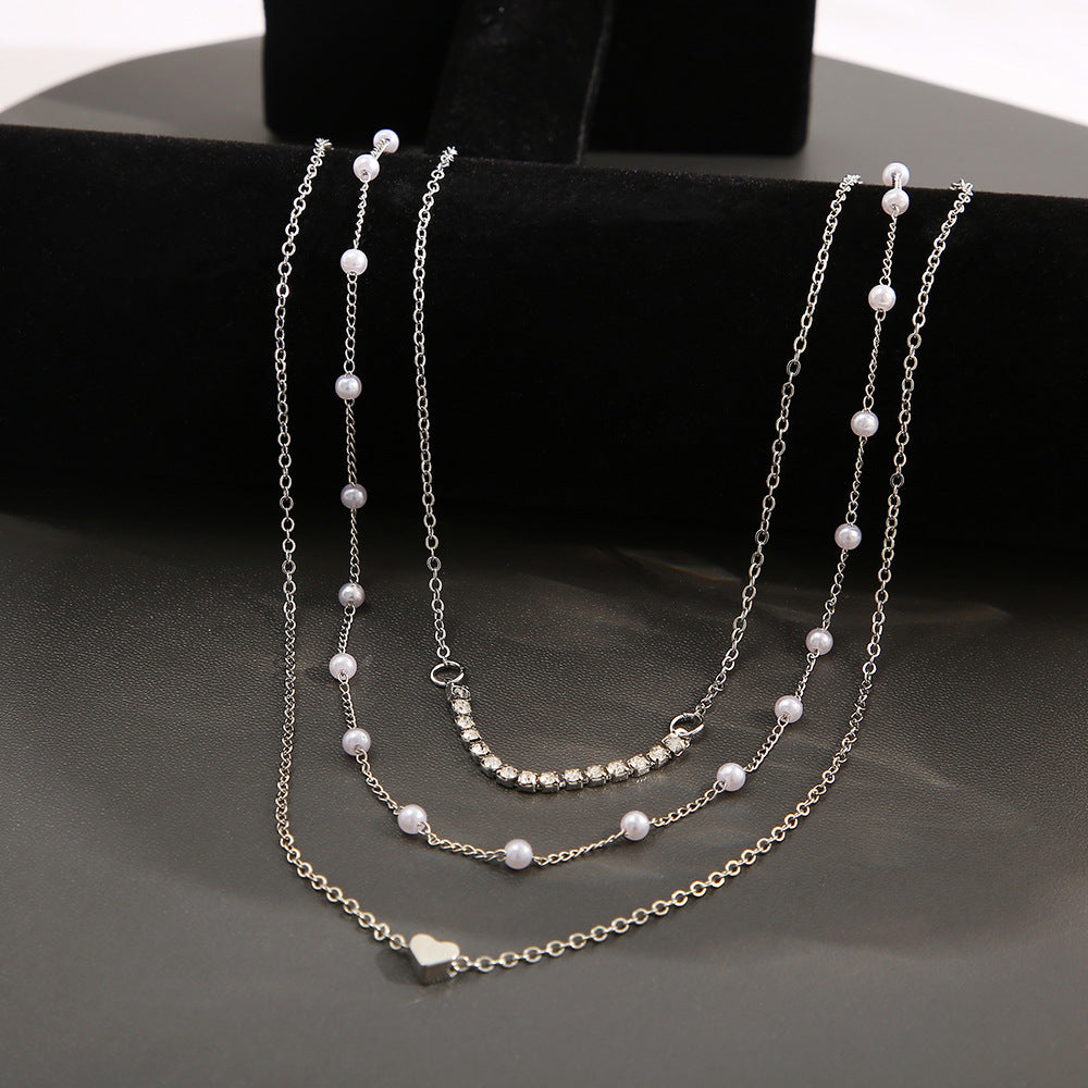 Heart-shaped diamond and pearl three-layer necklace