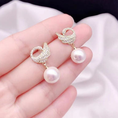 Pendientes de perlas y diamantes en forma de cisne