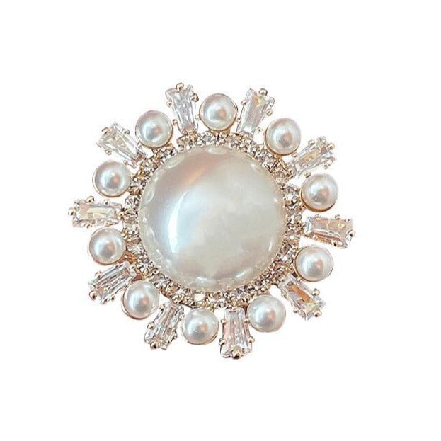 Round anti-pearl brooch