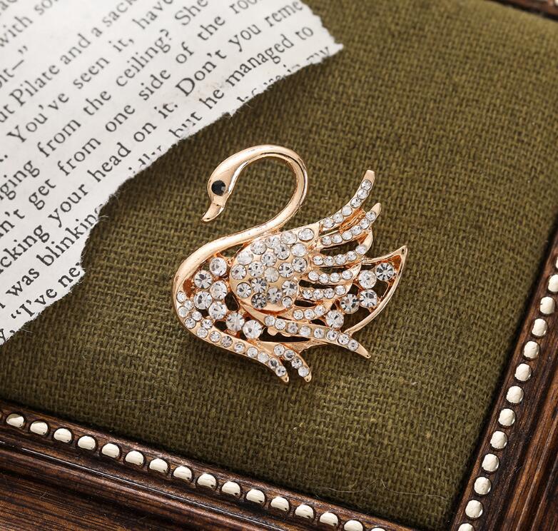 Diamond swan brooch ins