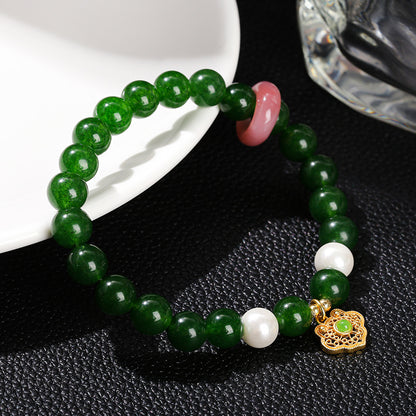 Imitation Hetian jade round bead bracelet.