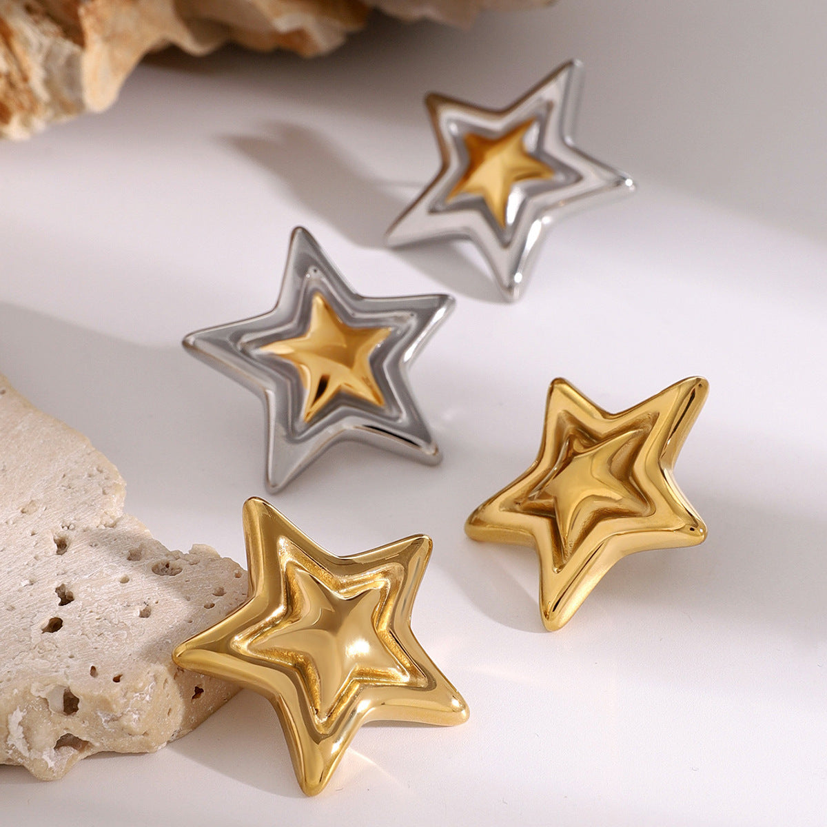 Concave and convex metal star earrings