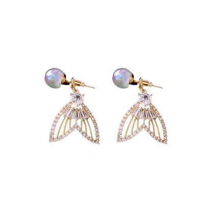 Pearl fishtail sparkling diamond earrings.