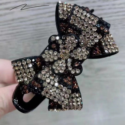 Accesorio para el cabello con pinza de tres dientes y diseño de mariposa con estampado de leopardo 