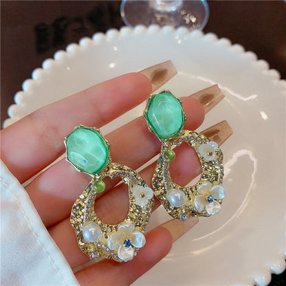 Flower pearl pleated hollow earrings,