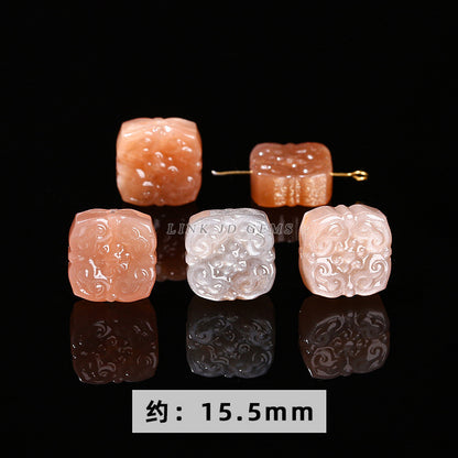 Talla de piedra lunar naranja y piedra solar 