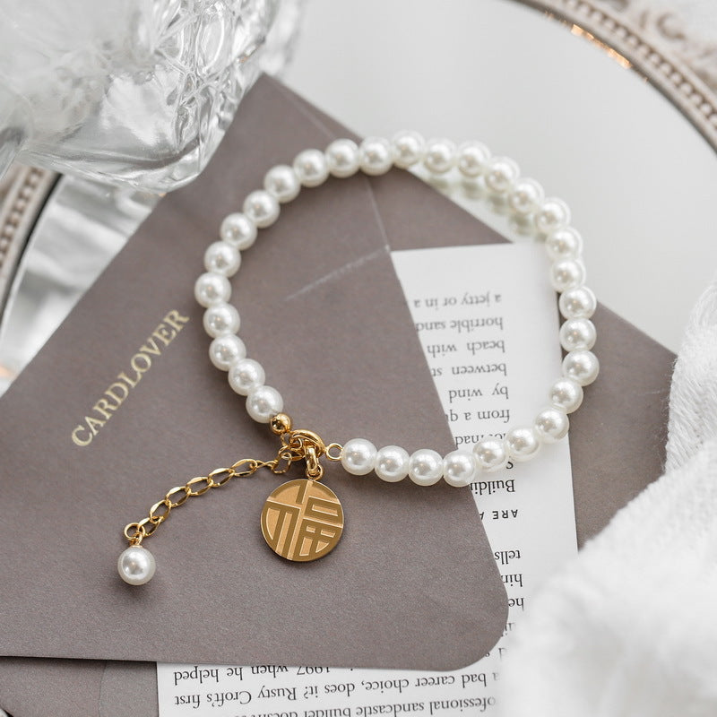 Pearl fringed Fu brand bracelet