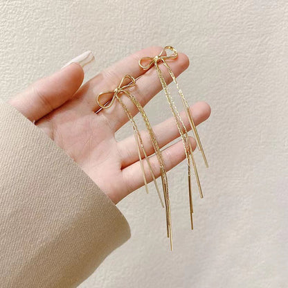 Metal extra long bow fringed earrings