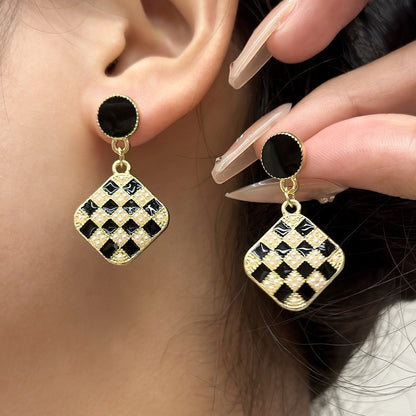 Black checkerboard rice bead earrings