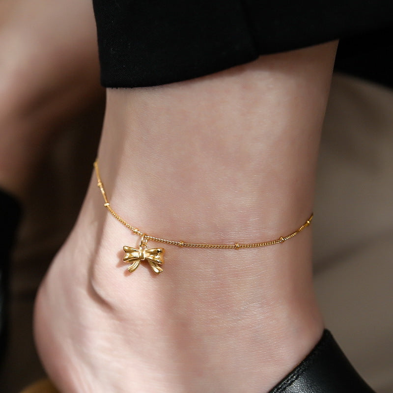 Gold bow anklet