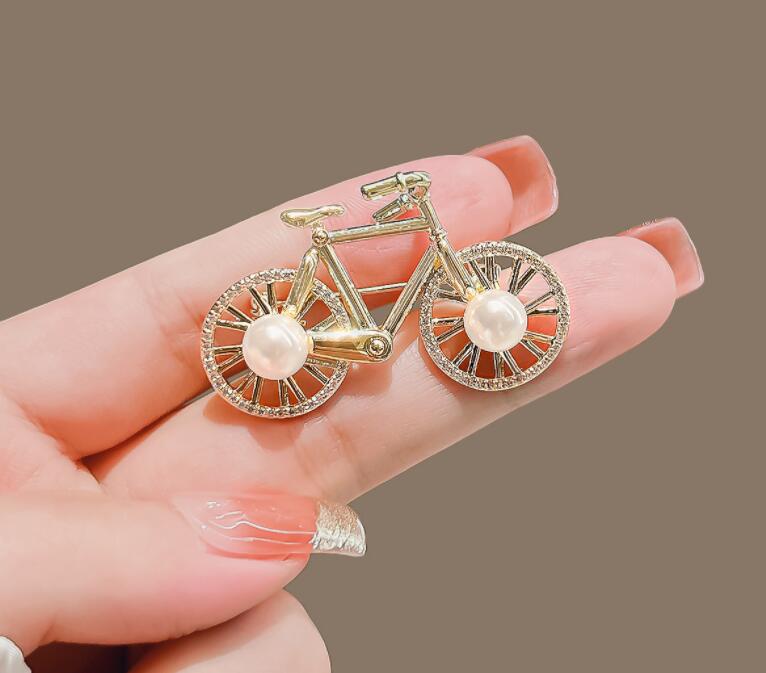 Cartoon bicycle brooch