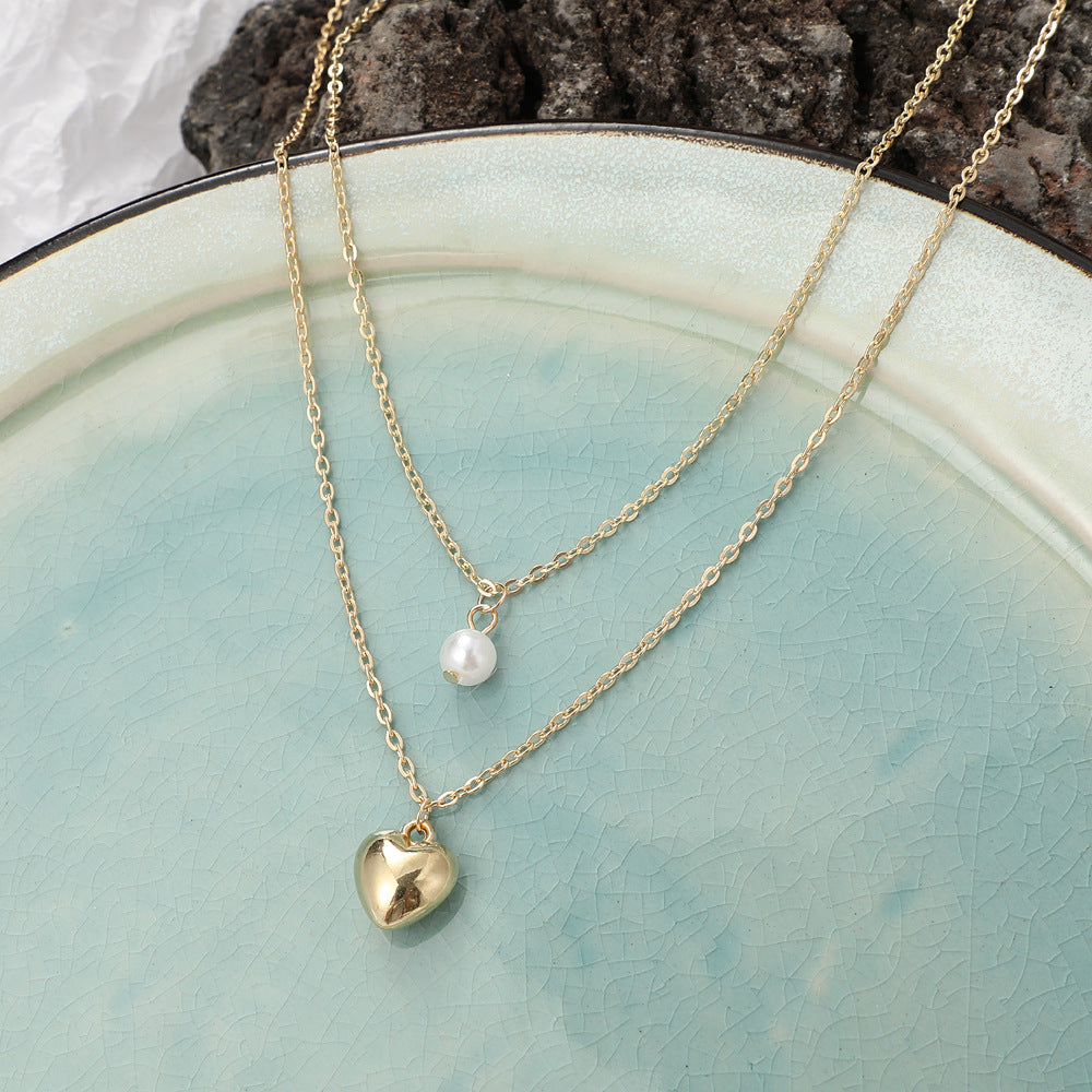 Multi-layered pearl heart necklace