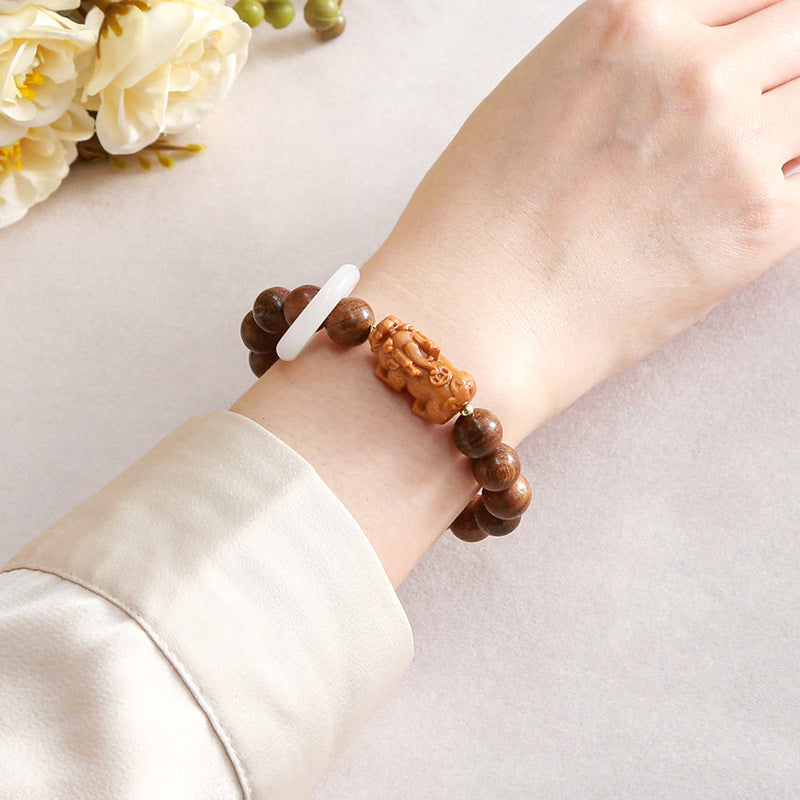 Golden sandalwood imitation white jade running ring bracelet.