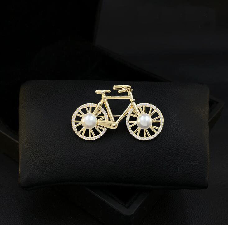 Cartoon bicycle brooch