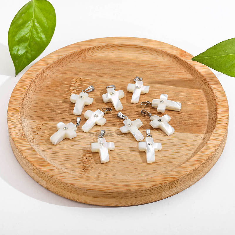 Natural white fritillary cross pendant.