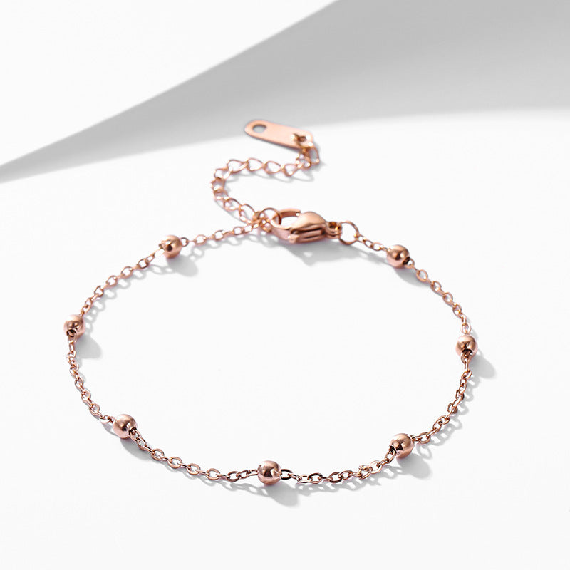 Elegante pulseira de contas em ouro rosa 18K em aço titânio 